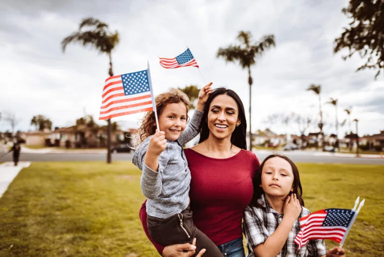 little boys with family celebrate the fourth of july