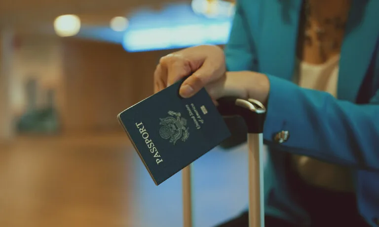 Woman with USA passport is waiting for her flight at the airport.