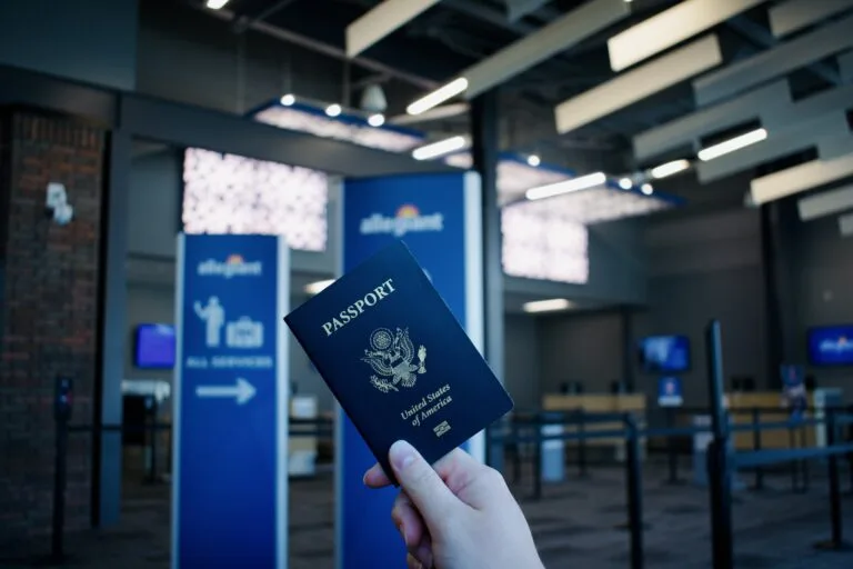 A US tourist holds a US passport while waiting for a flight at Provo Municipal Airport in Provo, Utah, U.S., on June 06, 2024.